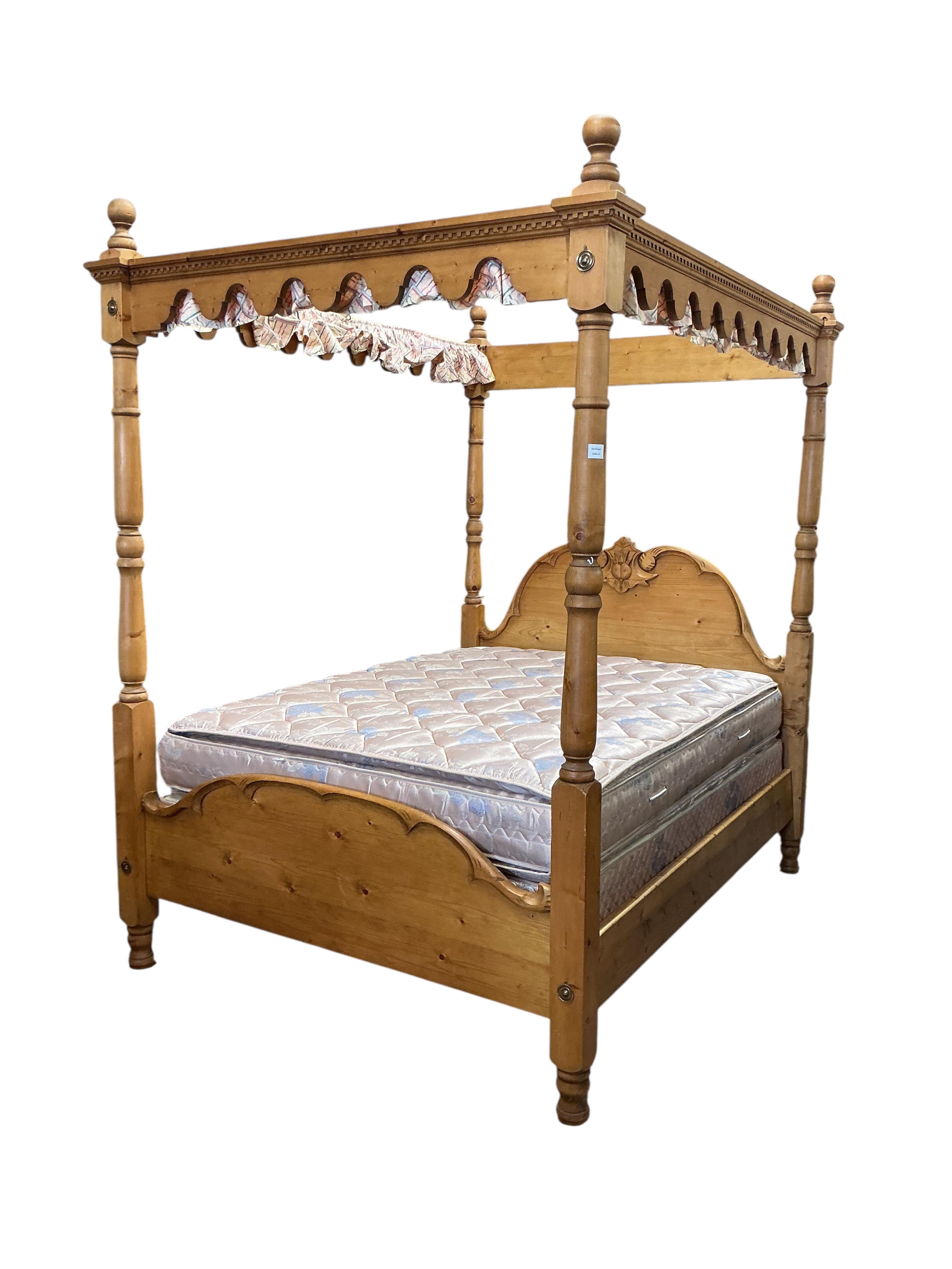 A Victorian style pine four poster double bed, length 212cm, width 166cm, height 240cm
